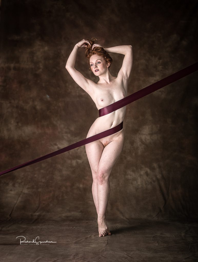 artistic nude photography - artistic nude photographer - model standing with a ribbon wraped around her middle
