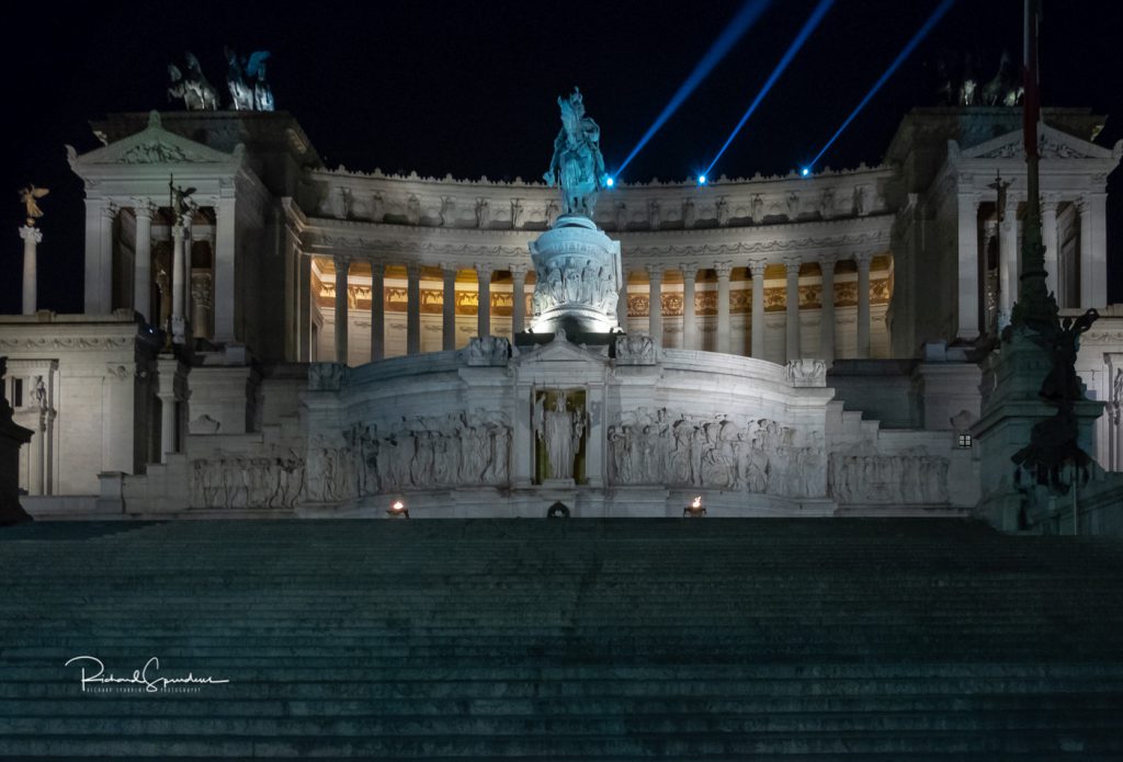 travel photography - travel photograher - colour image from a visit to rome showing the impressive Monumento Nazionale building lit up by the buildings lights photographing rome at night