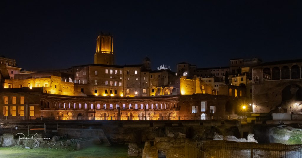 travel photography - travel photograher - colour image from a visit to rome a night shoot of the rome building lit by flood lights against the dark night sky.