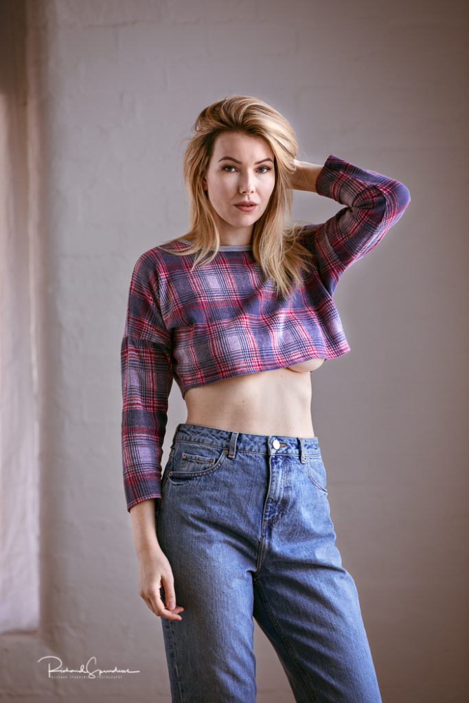 fashion photographer - fashion photography - a natural light colour image of model nicky phillips wearing jeans and a tarten top
