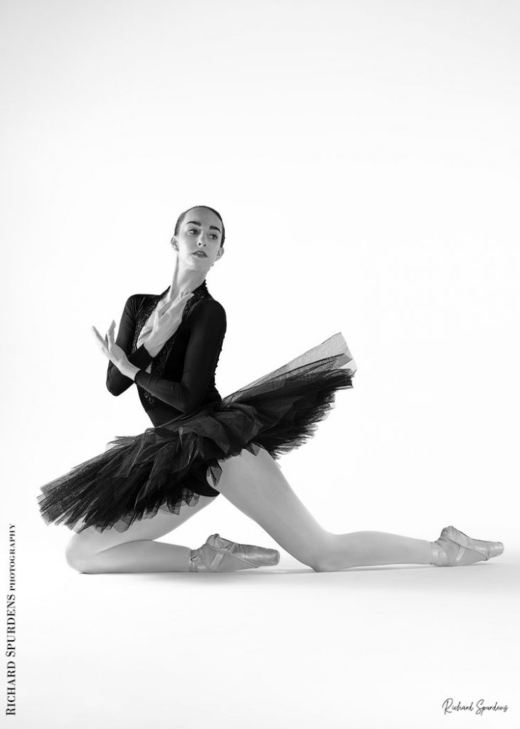 Dance Photographer - Dance photography - dancer Erica Mulkern wearing a black tutu as she makes some kneeling floor shapes