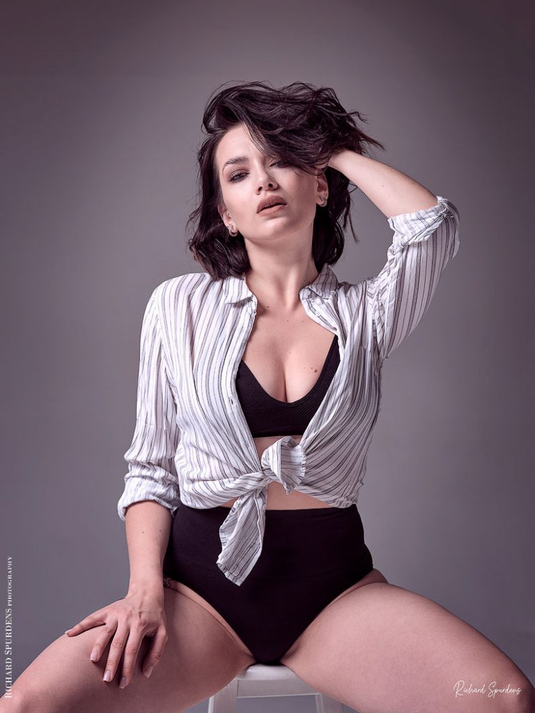 Fashion Photography - Fashion Photographer - colour image of model wearing striped shirt and black bra and pants